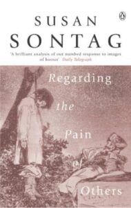 Cover of Regarding the Pain of Others by Susan Sontag, an exploration of how war photography influences public perception and moral responsibility.